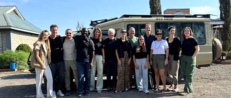 Group picture infront of car
