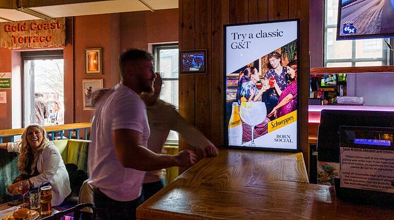 Schweppes advertisement in pub