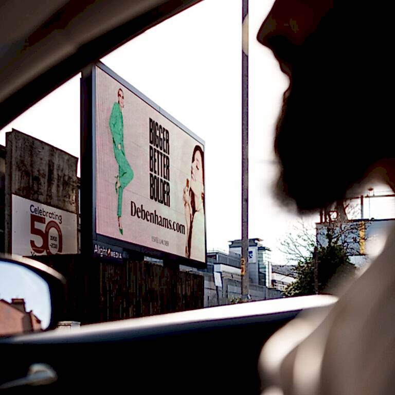 Debenhams advertisement viewed through car window
