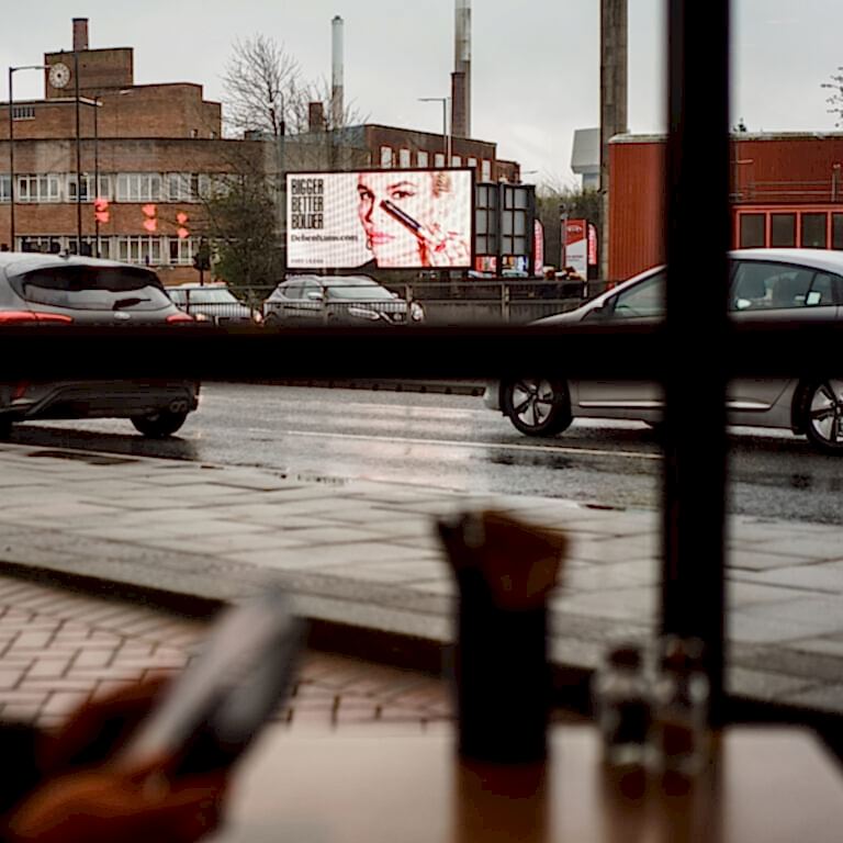 Debenhams advertisement viewed through restaurant