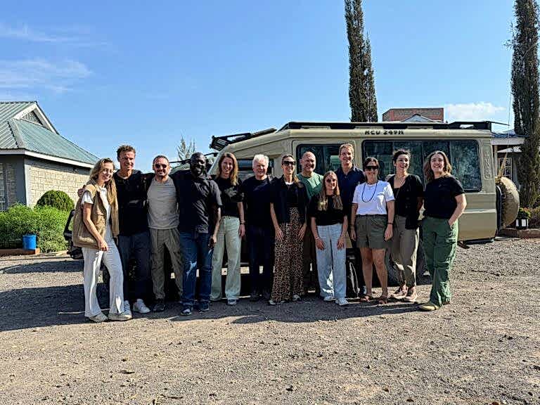 Group picture infront of car
