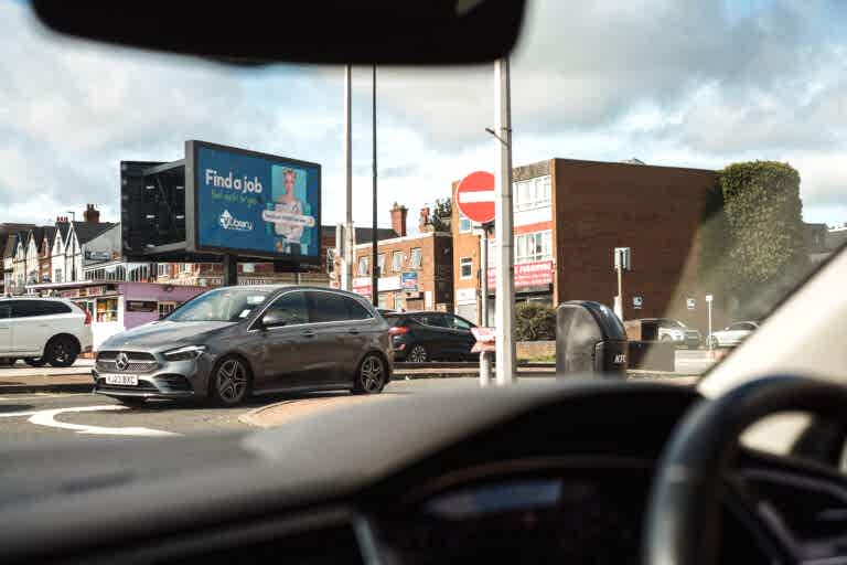 CV Library advertisement viewed through car windscreen